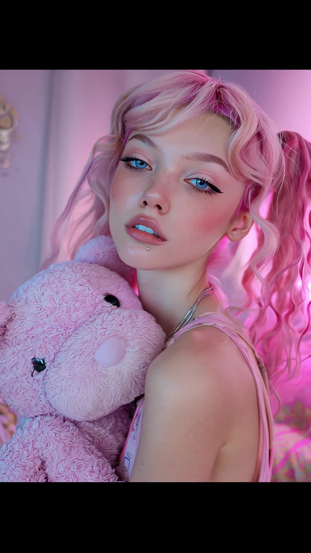Pink pigtails babe squeezes teddy in bedroom selfie