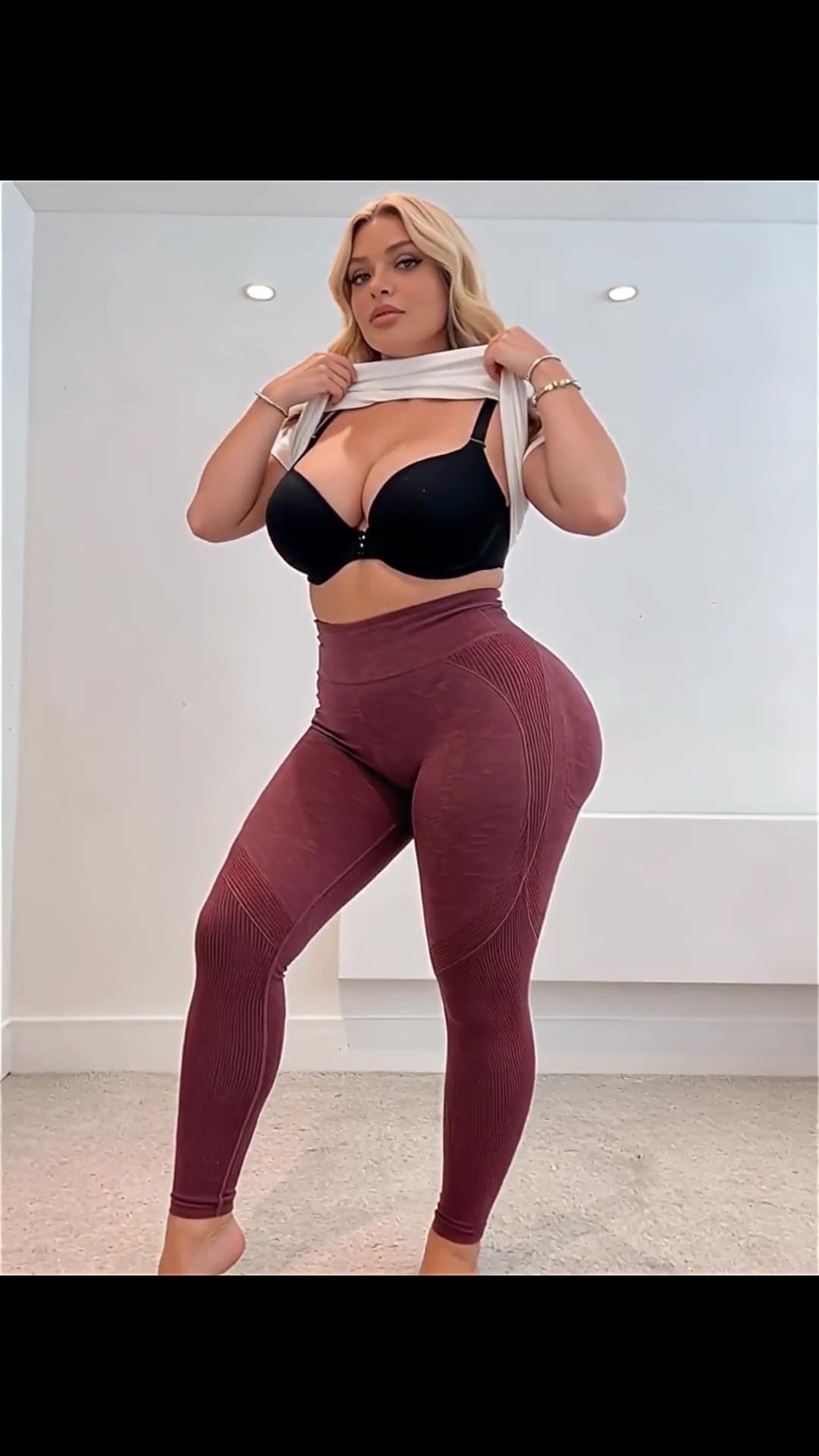 Curvy blonde showing big tits and round ass in crop top