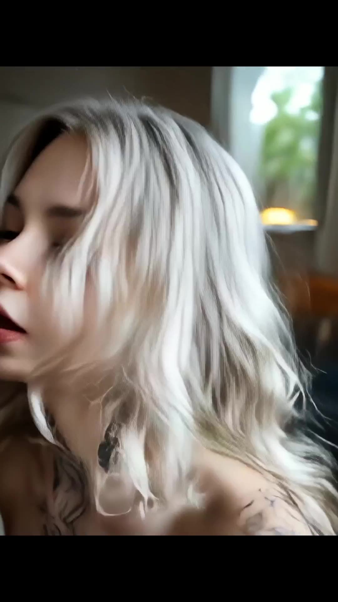 Young adult blonde close up topless tattoos