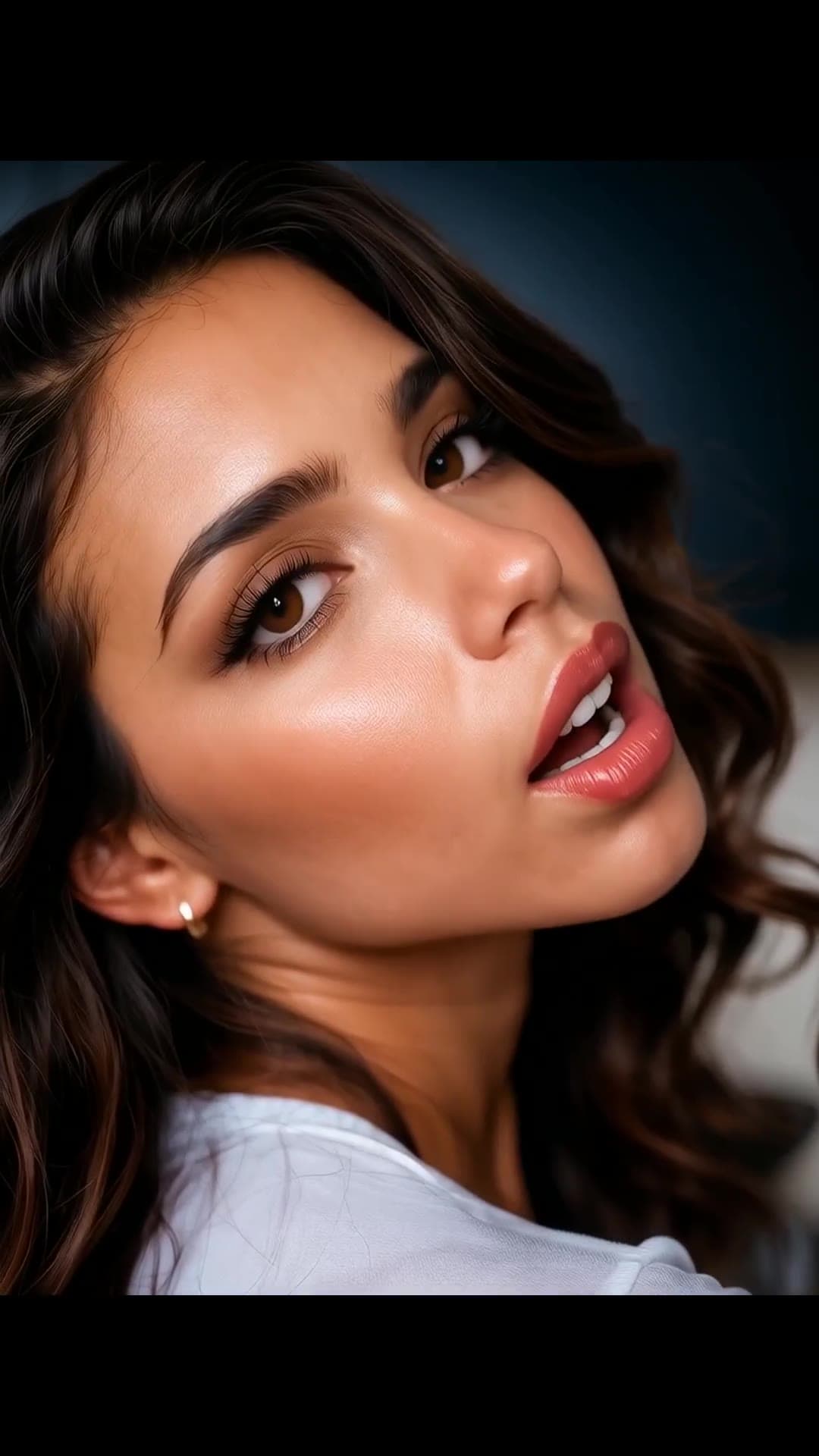Close-up brunette face and shoulders in white top