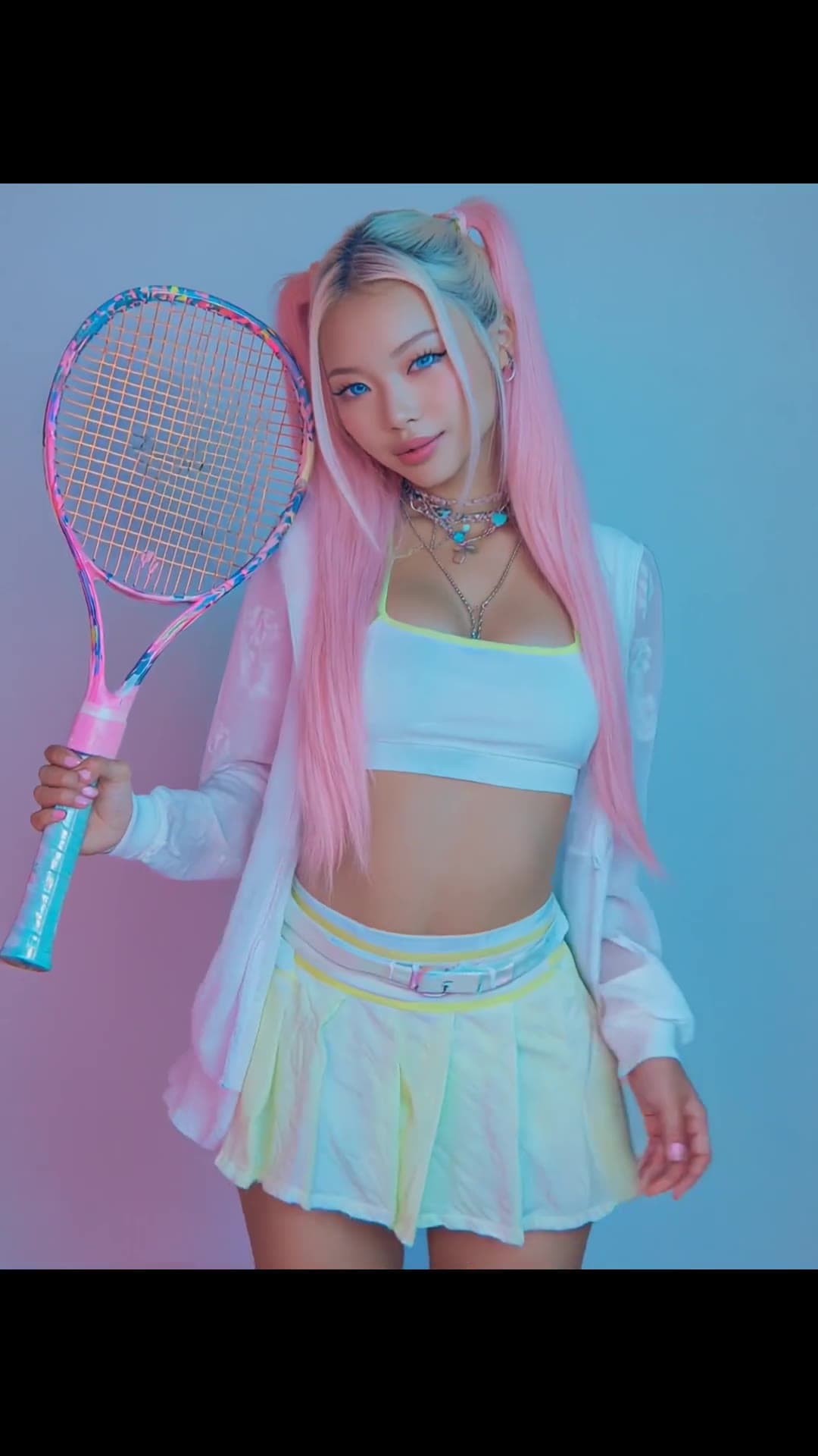 Pink pigtails tennis skirt studio pose