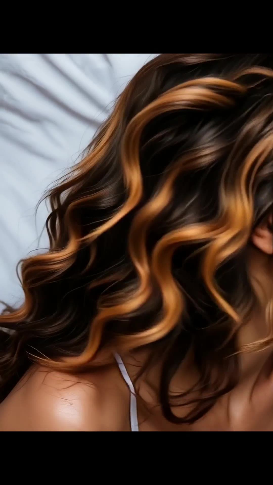 Curvy ebony back and wavy hair close-up