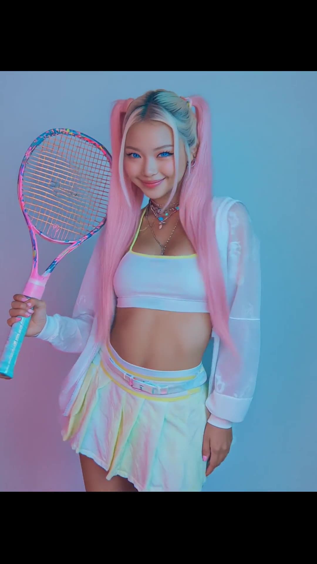 Studio pastel skirt tennis racket pose