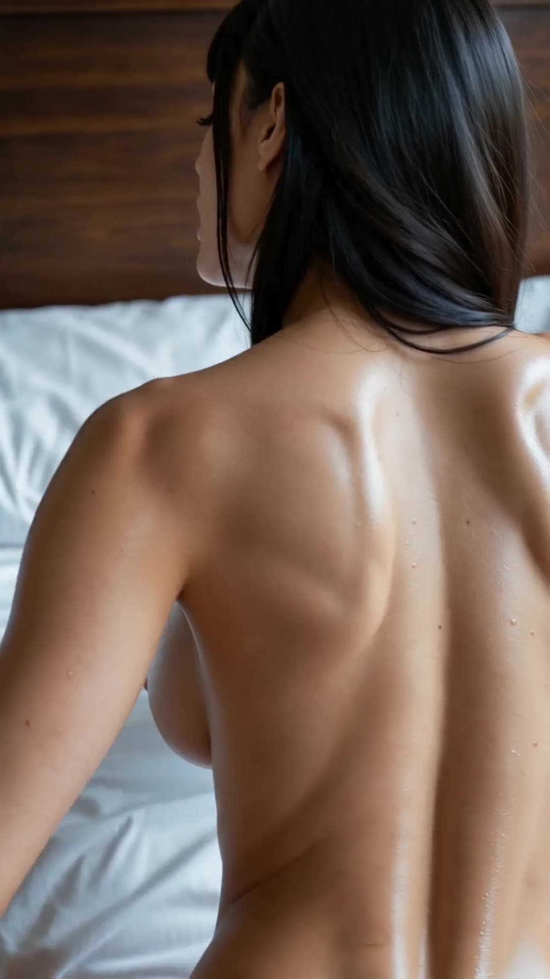 Back view topless on bed