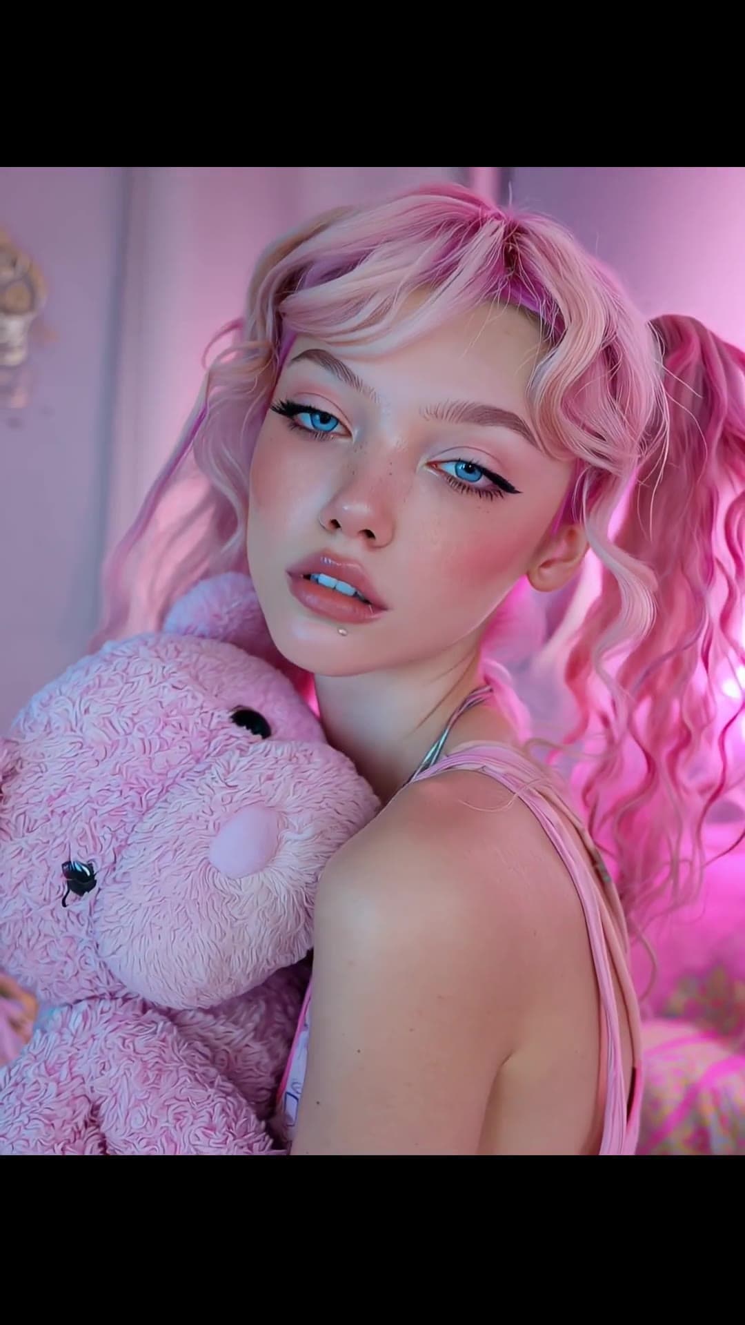 Pink pigtails close-up with teddy bear