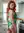 Curvy redhead lingerie kitchen pose