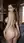 Nude from behind in wine cellar