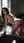 Brunette fingering herself on bed