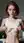 Redhead lifts tank top in kitchen
