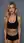 Curvy blonde sports bra mirror shot