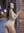 Curvy nude alley over-shoulder glance