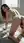Brunette on all fours plugs her ass