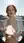 Young redhead flashes on sunny balcony