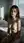 Slim nude on sunlit bed