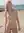 Nude pink hair beach pose