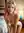 Early 20s pink hair nude kneel
