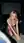 Nude blonde kneeling in empty theater