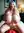 Viktoria in a dim bedroom, hands on her chest