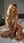 Nude blonde legs spread on bed