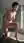 Nude pixie stands in bathtub