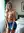 Topless blonde pulling skirt down