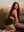 Athletic brunette on all fours rooftop glance