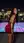 Back view red dress on rooftop city night