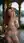 Young adult redhead topless balcony