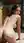Brunette on all fours in kitchen