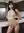 Nude barista in modern kitchen