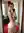 Young adult redhead in satin dress