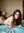 Folded nude on stomach looking back