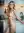 Blonde nude in bright kitchen