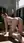 Slim brunette arched on all fours