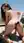 Brunette nude butt plug on terrace