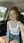 Redhead with glasses laughing in car passenger seat