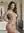 Living room over-shoulder nude glance