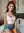 Curvy brunette in unbuttoned shorts