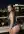 Wavy brunette backless dress rooftop