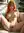 College-age redhead spreads on couch
