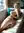 Curvy nude reclining on white leather couch