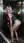 Blonde in elevator bodysuit looks back