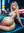 Nude platinum blonde over shoulder on couch