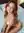 Nude redhead on white bedsheets