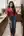 Casual red top kitchen pose