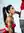 Jada in a Dim Studio With Her Hair in a High Ponytail