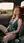Curvy redhead in car seatbelt