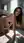 Nude brunette on bathroom floor
