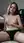 Young adult topless on bed