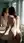 Young brunette bent over sink